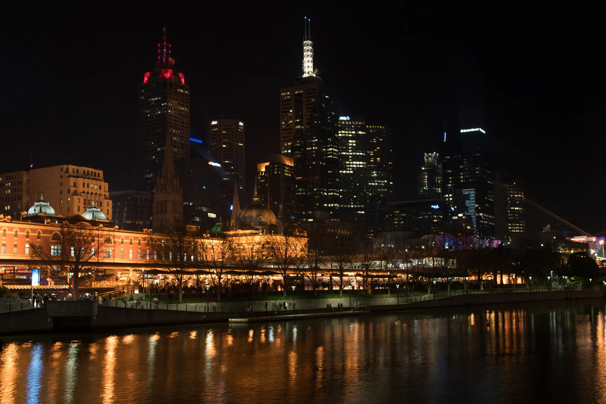 Melbourne Skyline | Sukh Sandhu Melbourne's illuminated skyline reflects on the Yarra River at night.