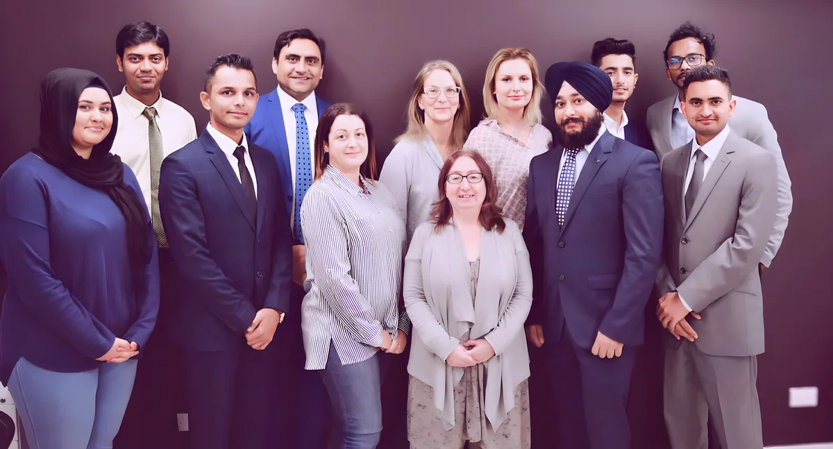 Sukh Sandhu with the team — photograph 2