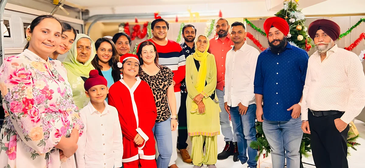 Sukh Sandhu with the team — photograph 4